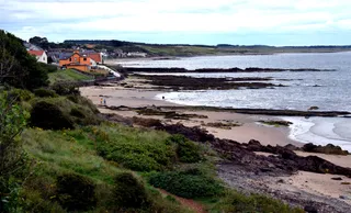 Largo Bay coastline seen from above, with the beach and village in the distance